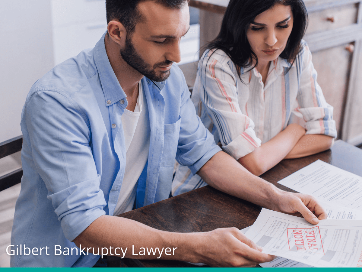 Couple reading a foreclosure notice