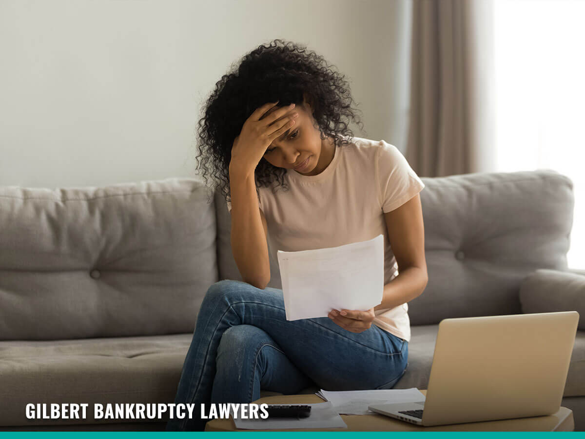 Woman Recieving a debt lawsuit in Gilbert, AZ